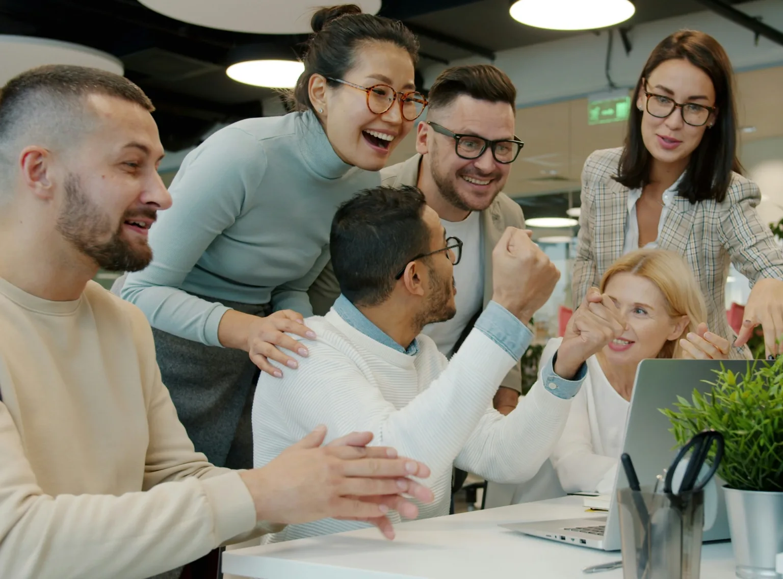 A team celebrating a product demo and video documentation ready in every language